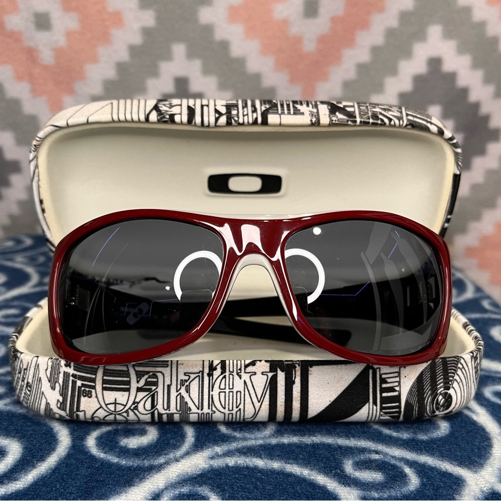 Women’s Oakley Dark Maroon/Dark Red Sunglasses with Case.